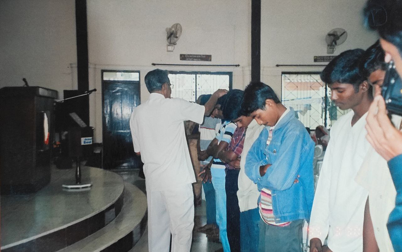 Laying on of hands in prayer